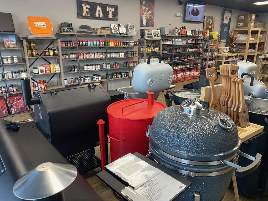Charcoal BBQ grills on a retail display floor