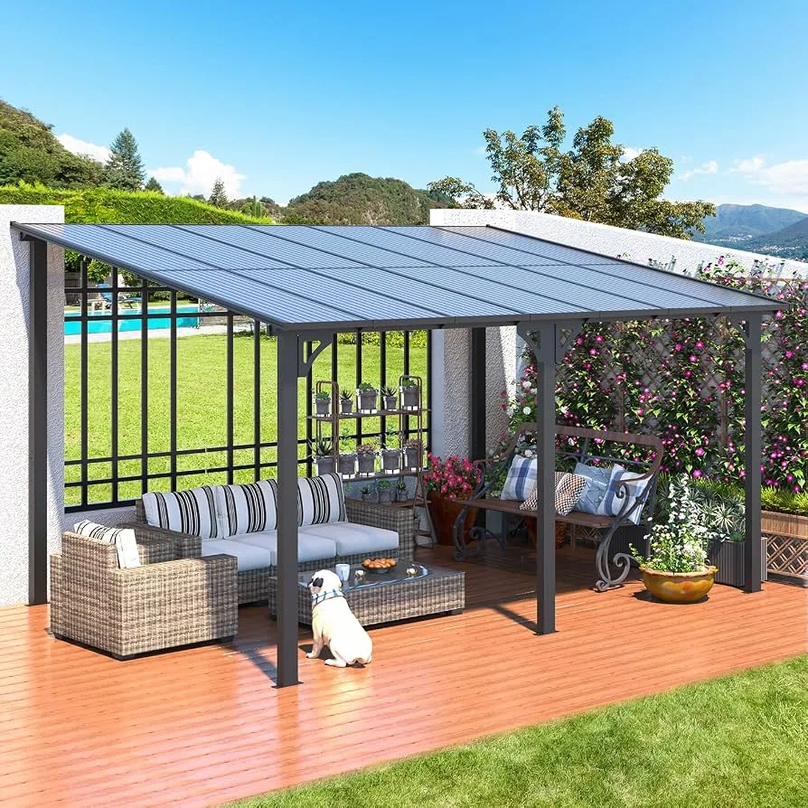 Aluminum pergola with a closed polycarbonate roof casting patterned shade over a rattan outdoor sofa set on a wooden deck