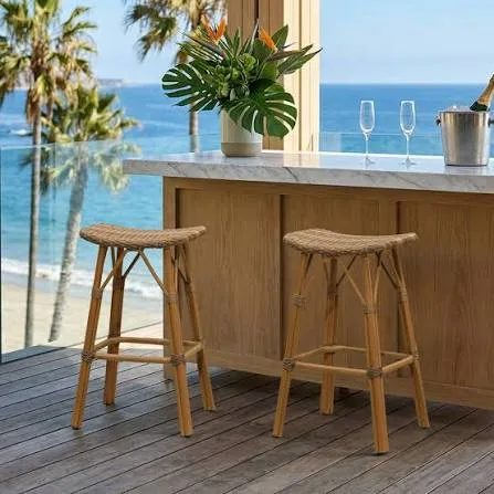 Backless and low-back bar stools tucking under a counter to save aisle space