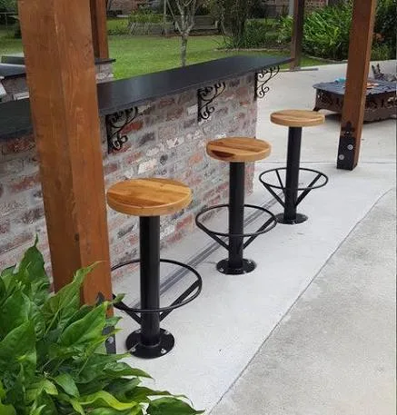 Bolt-down cantilever bar stool floor-anchored with a cantilevered seat