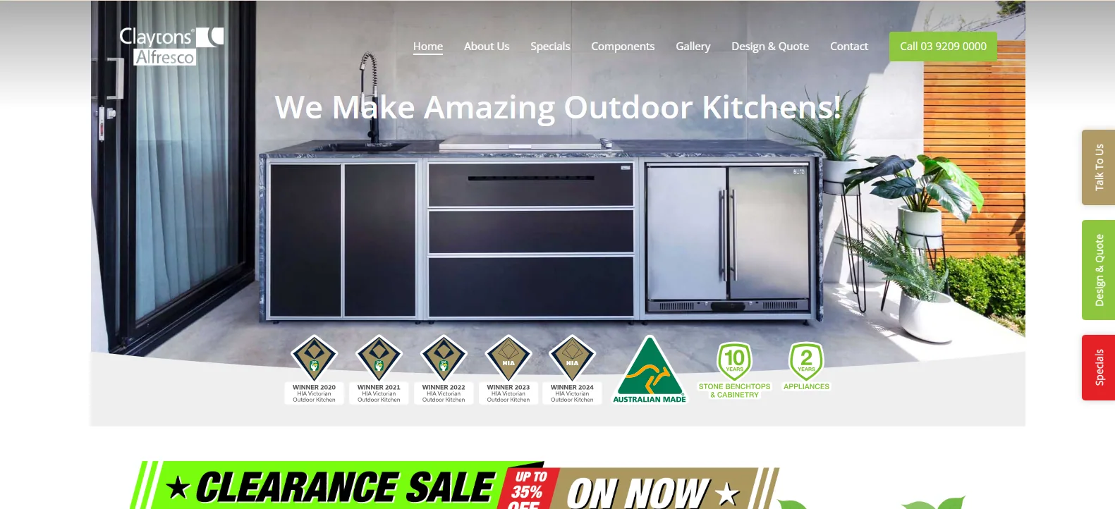 Claytons Alfresco homepage reading We Make Amazing Outdoor Kitchens, showing a grey modular outdoor kitchen with a stainless fridge and grill under a clearance sale banner