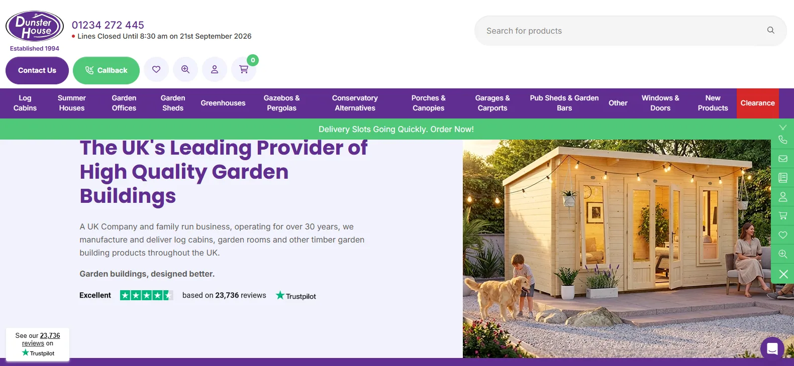 Dunster House homepage showing a pressure-treated timber garden building with glazed doors, warm interior lighting and festoon lights, headed The UK's Leading Provider of High Quality Garden Buildings