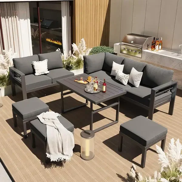 Powder-coated aluminum dining table and slat-back aluminum armchairs on a garden terrace