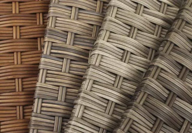 Close-up of wood-look and textured PE rattan strands woven in a diagonal pattern