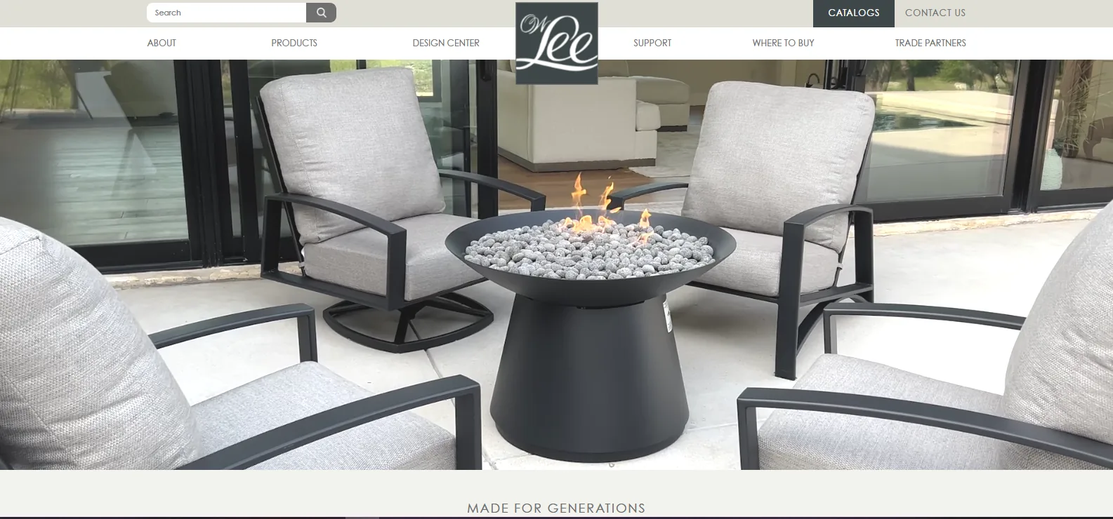 O.W. Lee cushioned lounge chairs arranged around a fire table