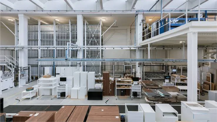 Outdoor furniture factory production floor — QC inspection in progress