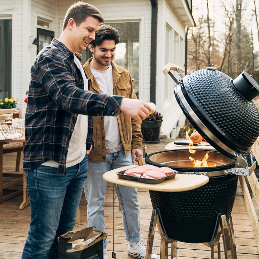 Premium kamado ceramic grill in modern backyard outdoor kitchen — OGPS manufacturing