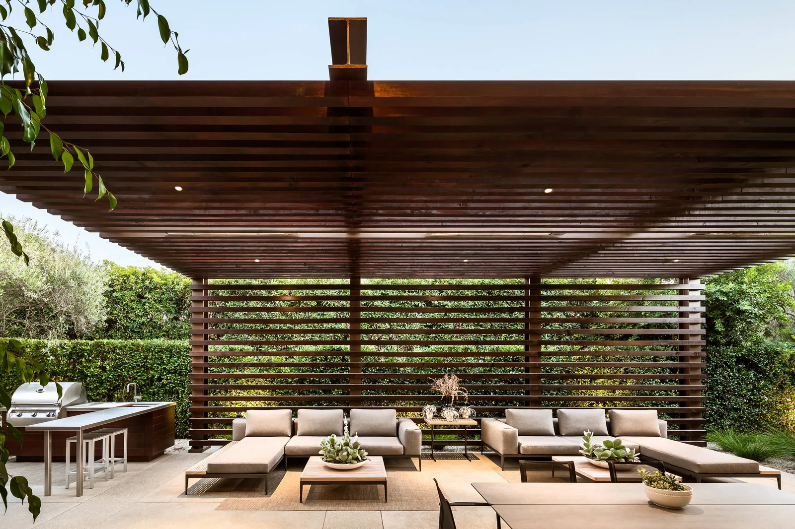 Pergola and umbrella shade structures connecting resort zones