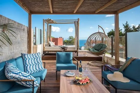 Private villa terrace lounge seating by a pool
